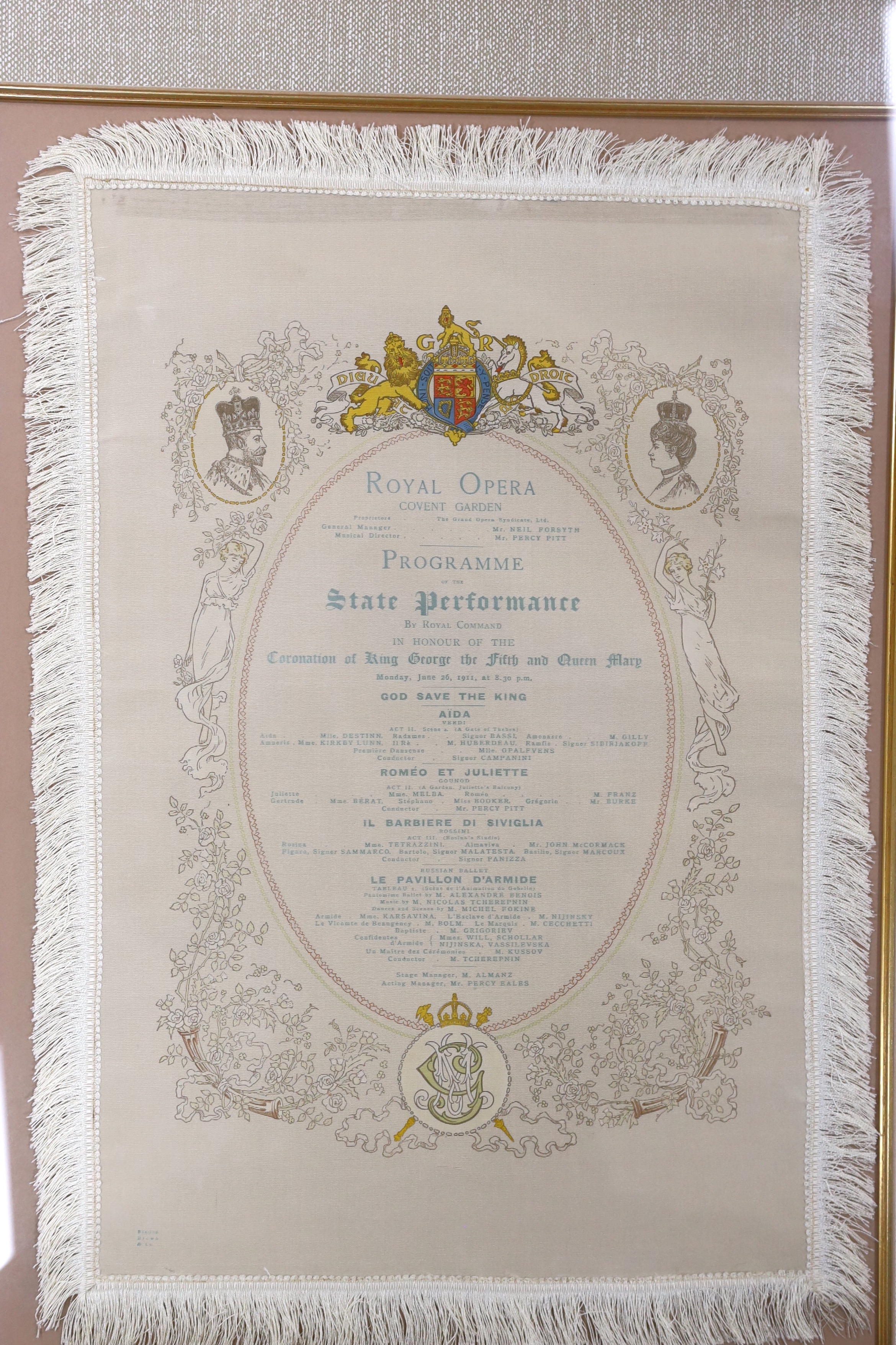 A framed early 20th century silk opera programme, Royal Opera House Covent Garden, State Performance 26th June 1911, printed by Finden Brown & Co., 41 x 27cm not including fringe